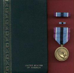 Humanitarian Service Award medal in case with ribbon bar and lapel pin